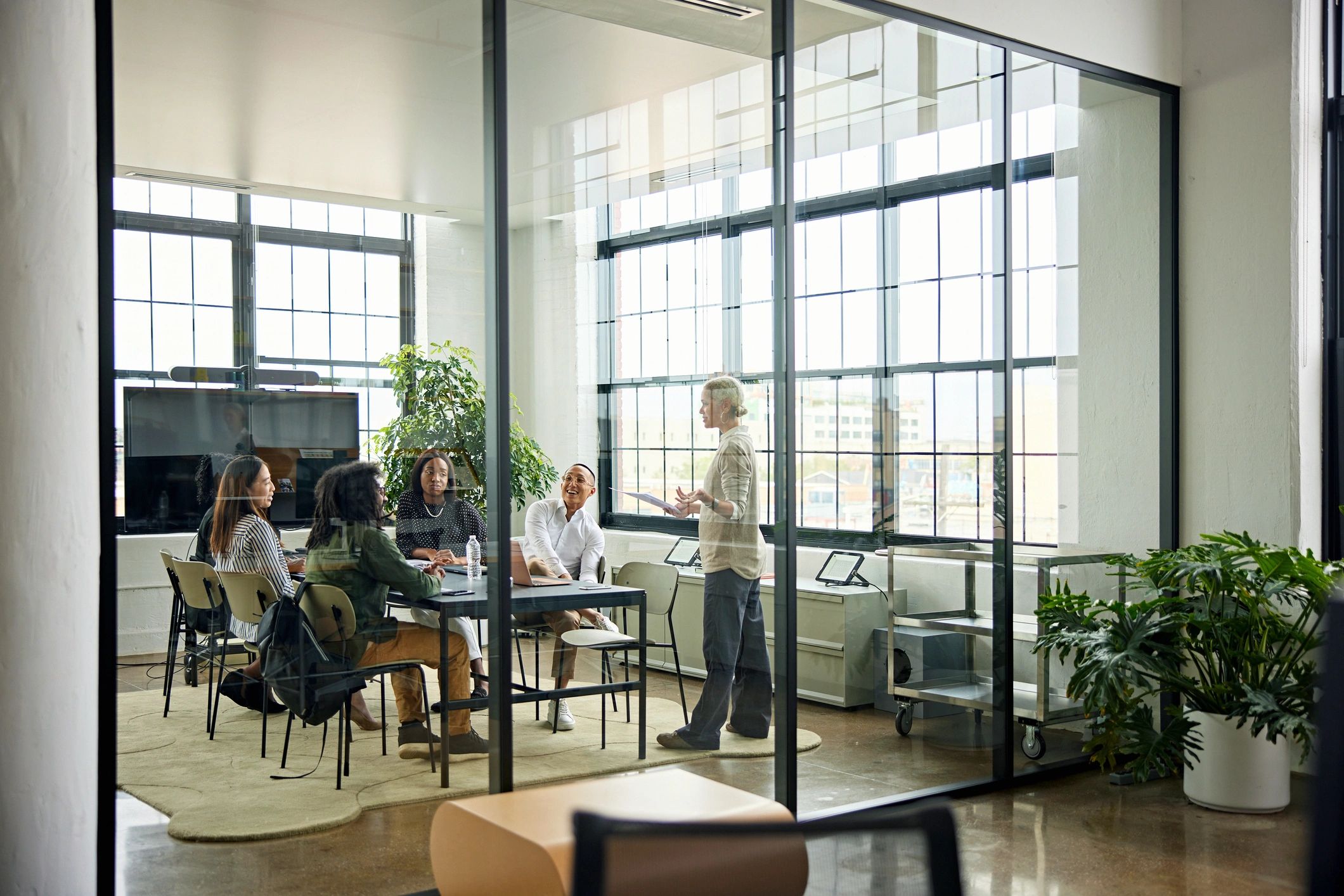 Sparrows Tech team collaborating in a modern meeting room