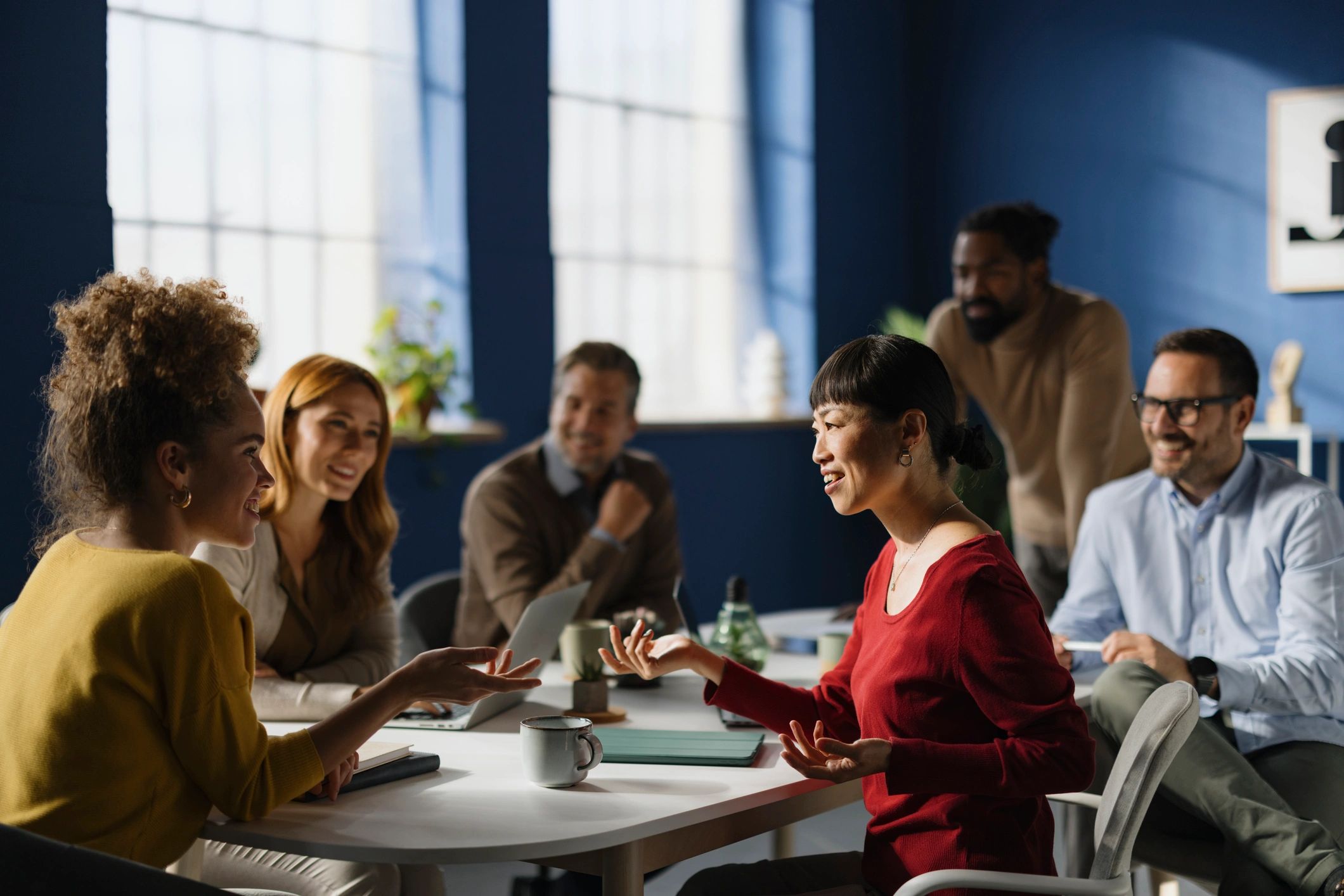 Colleagues collaborating in an office meeting